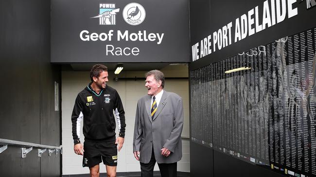 Legendary Port Adelaide footballer Geof Motley unveils the Geof Motley Race at Adelaide Oval with outgoing captain Travis Boak in 2014. Picture: SARAH REED.