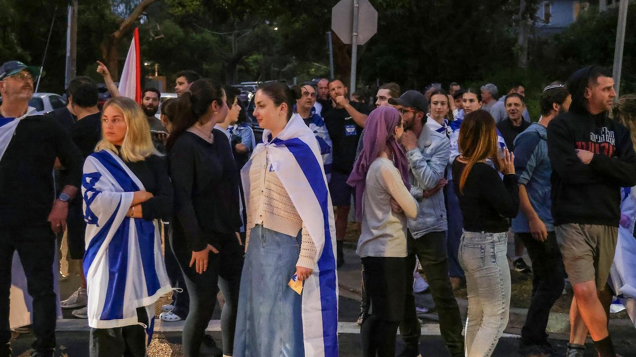 Jewish people outside Caulfield Hebrew Congregation which was the site of an earlier protest. Picture: NewsWire / Ian Currie