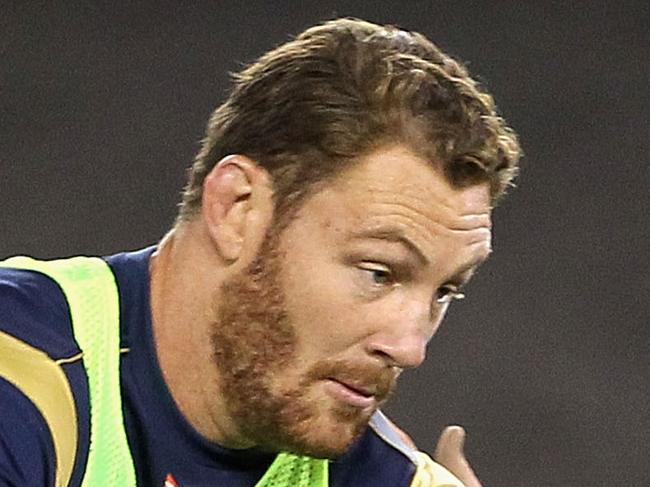 MELBOURNE, AUSTRALIA - JUNE 13: Scott Higginbotham runs the ball during an Australian Wallabies captain's run at Etihad Stadium on June 13, 2014 in Melbourne, Australia. (Photo by Robert Prezioso/Getty Images)