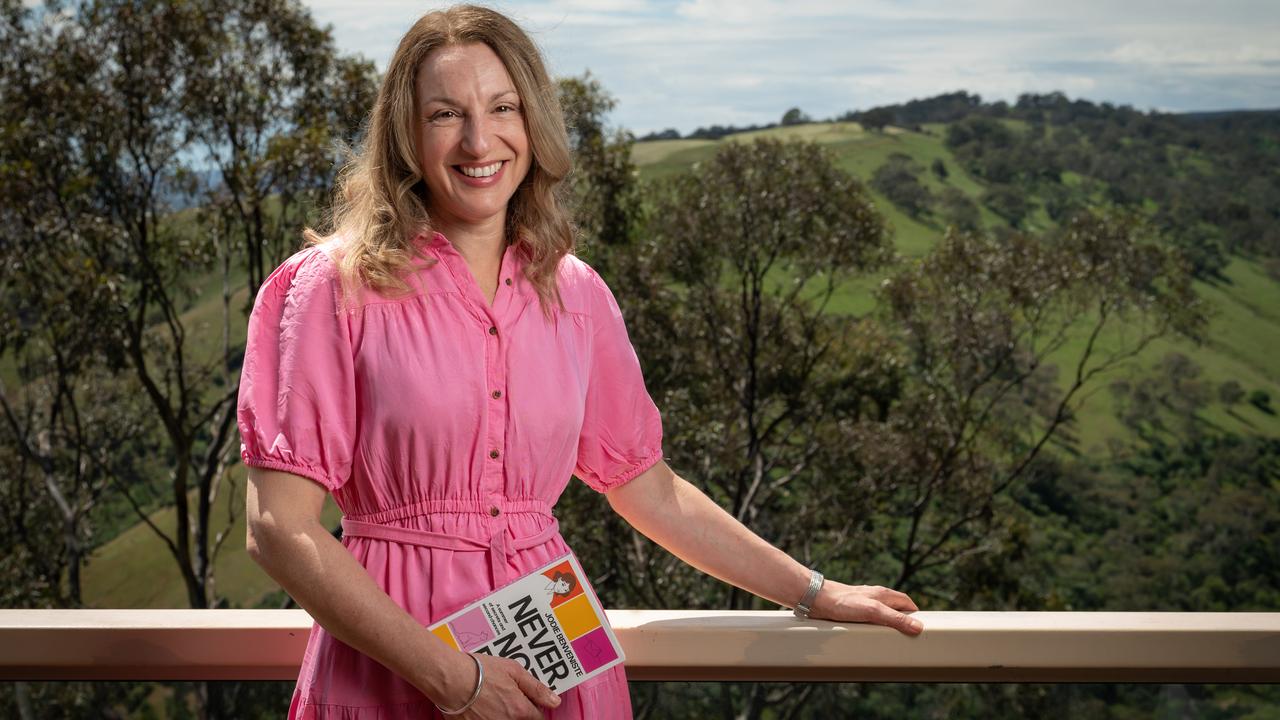 Psychologist and author Jodie Benveniste with a copy of her young adult fiction novel Never, Not Ever. Photo: Naomi Jellicoe