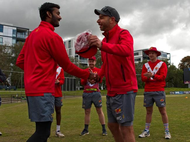 Will Carr presents Ruwantha Kellepotha with his First XI cap. Pic: Chris Thomas, Cricket Victoria.