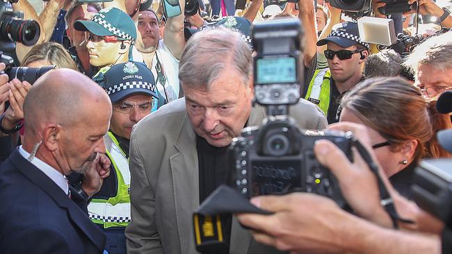 George Pell swamped by media at Melbourne County Court. Picture: Getty Images