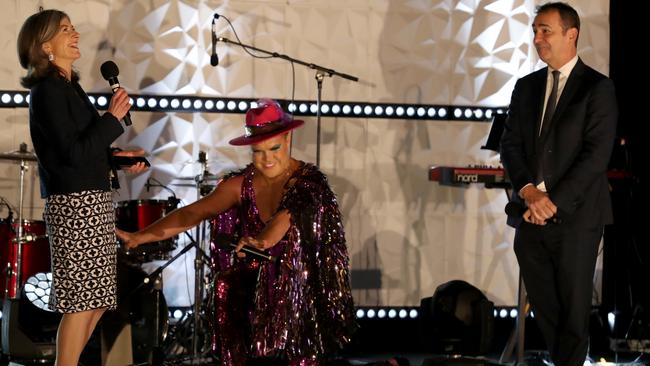 Chief Public Health Officer for SA Health is Associate Professor Nicola Spurrier is worshipped by Hans with Premier Steven Marshall at a performance for Pullman Hotel guests. Picture: Kelly Barnes/Getty Images