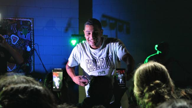 Fans watch Darwin-born rapper J-MILLA perform live in Wadeye on June 1, 2023 while the concert is streamed live on TikTok. Picture: Jason Walls