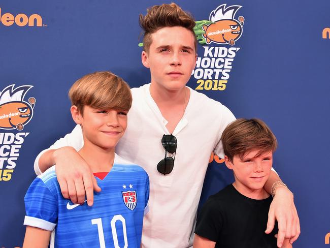 The Beckham boys Romeo, Brooklyn and Cruz are expected to make the trip to the Harbour City with their parents. Picture: Alberto E. Rodriguez/Getty Images