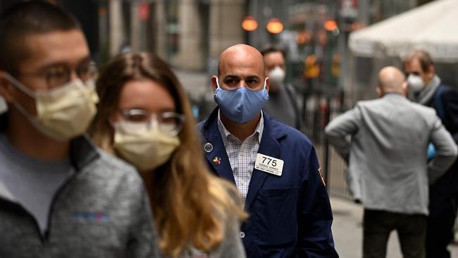 A trader walks in front of the New York Stock Exchange. Picture: AFP