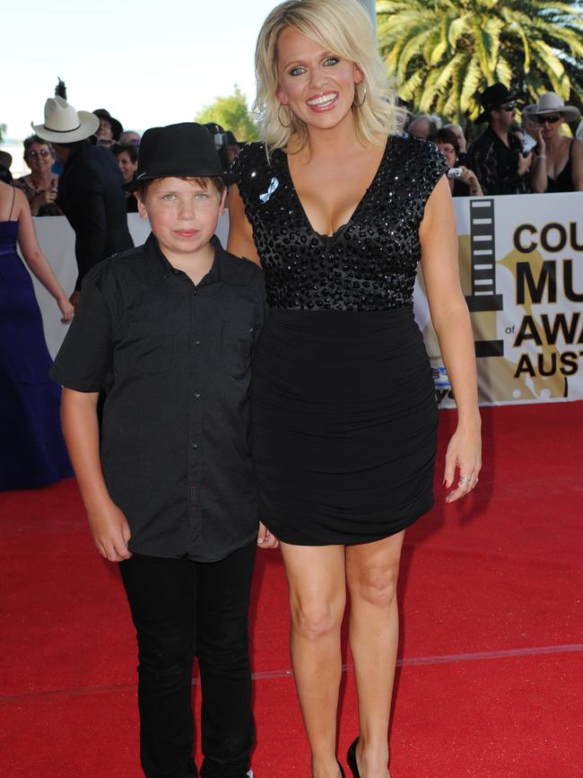 A young Ricky Albeck pictured in 2011 with his mum Beccy Cole at the 39th CMAA Country Music Awards. AAP Image: Tracey Nearmy