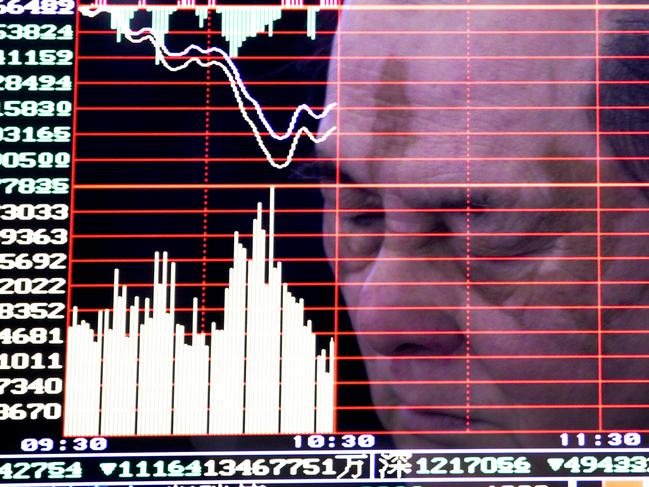 A man is reflected on a monitor screen displaying stock index at a brokerage house in Handan in north China's Hebei province, Monday, Jan. 4, 2016. Shanghai's stock index plunged nearly 7 percent on Monday, sparking a halt in trading of Chinese shares, after weak manufacturing data and Middle East tensions weighed on Asian markets. (Chinatopix via AP) CHINA OUT