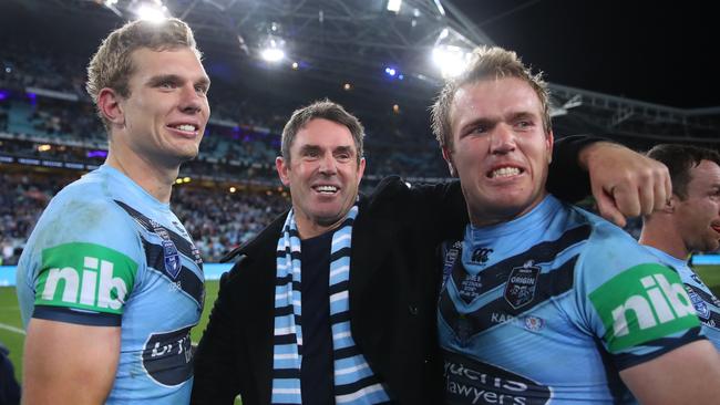 Blues coach Brad Fittler celebrates with Tom Trbojevic and Jake Trbojevic after an Origin win in 2019. Picture: Cameron Spencer/Getty Images