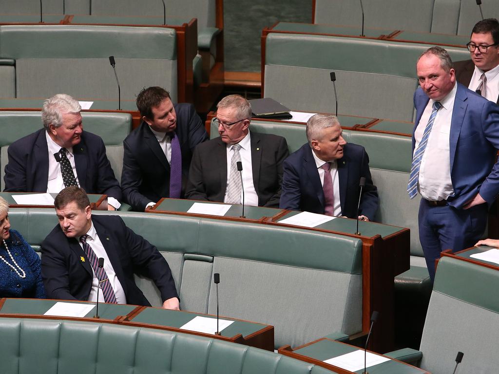 Nationals MPs talking  in the House of Representatives Chamber at Parliament House in Canberra. Picture Kym Smith