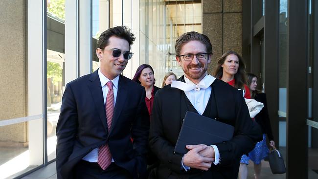 Journalist Joe Aston leaving Federal Court with his lawyer in the defamation trial against Elaine Stead. Picture: Jane Dempster