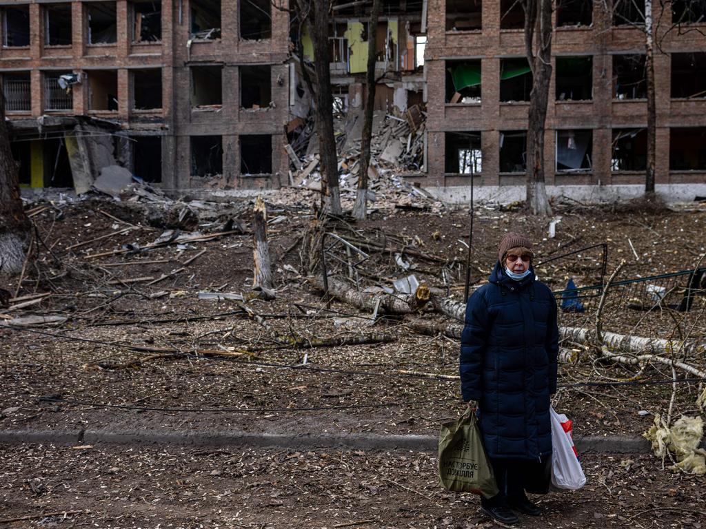 A woman stands in front of a destroyed building after a Russian missile attack in the town of Vasylkiv, near Kyiv. Picture: AFP