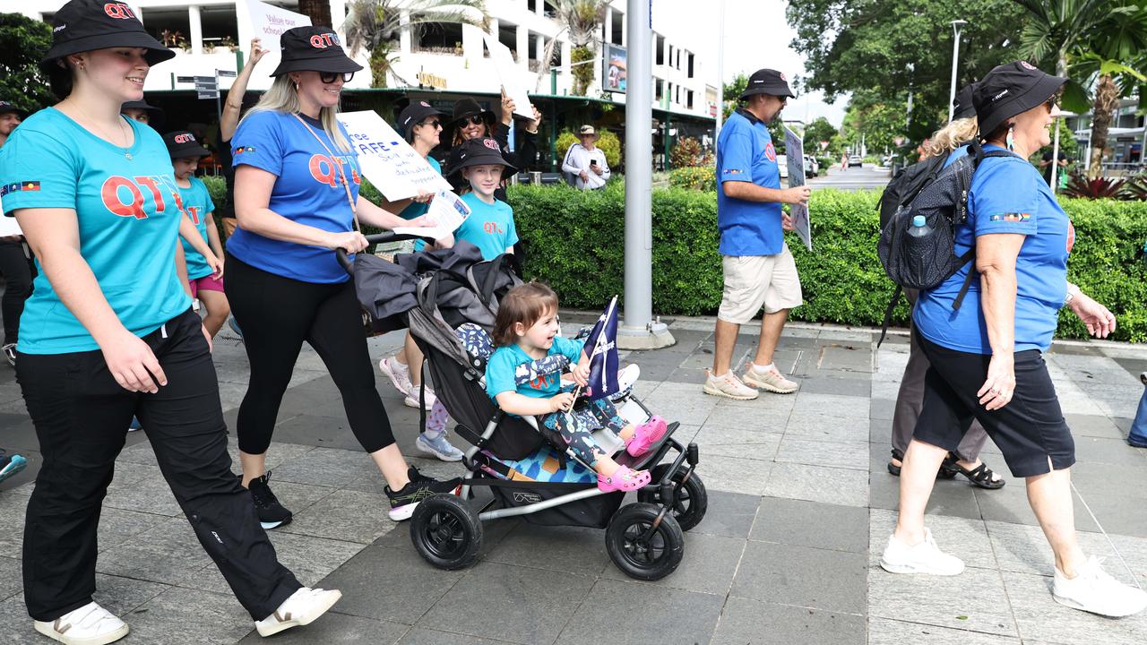 Queensland Teachers Union member Emma Gulliford and her children Alfie Cook, 5, and Daisy Cook, 2, participate in the annual Labour Day march along the Cairns Esplanade. Picture: Brendan Radke