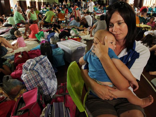 02/02/2011 NEWS: 02/02/2011 NEWS: Jenny Bolton , with her son James Friel , 9 mths, she is very worried her house will not survive, is among over 700 people take shelter in the town shire hall ahead of extreme Cyclone Yasi , hitting the town later tonight, Innisfail, FNQ.