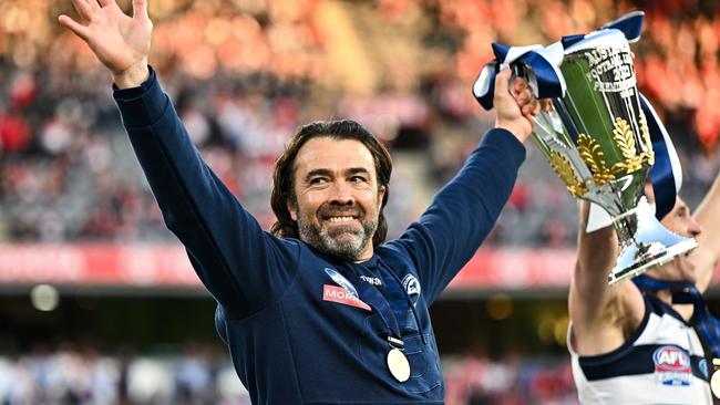 MELBOURNE, AUSTRALIA - SEPTEMBER 24: Chris Scott, Senior Coach of the Cats raises the Premiership Cup during the 2022 Toyota AFL Grand Final match between the Geelong Cats and the Sydney Swans at the Melbourne Cricket Ground on September 24, 2022 in Melbourne, Australia. (Photo by Daniel Carson/AFL Photos via Getty Images)