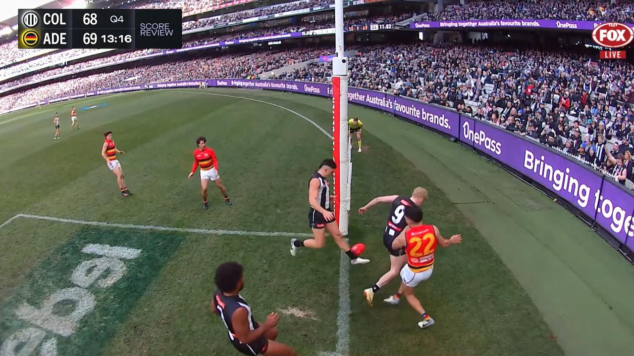 Did it cross the line before Brayden Maynard touched it? Picture: Fox Footy