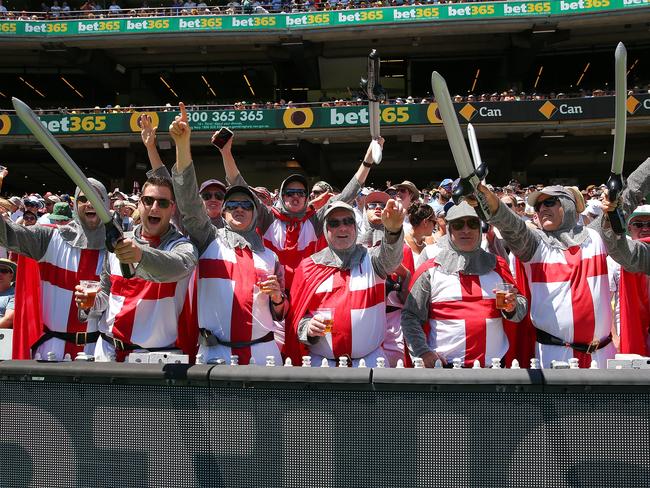 England fans dressed as knights celebrates after an Australian wicket