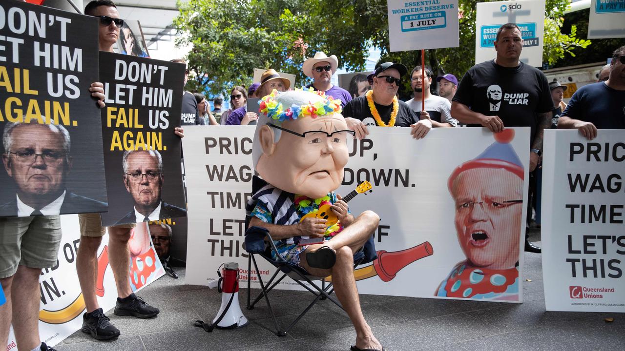 Protesters gather outside the Coalition’s campaign launch on Sunday at the Brisbane Convention and Exhibition Centre. Picture: Jason Edwards