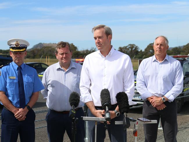 Assistant Commissioner Adrian Bodnar, MP Dean Young, Transport and Infrastructure Minister Michael Ferguson and Road Safety Advisory Council chair Scott Tillyard at the Tasman highway at Cambridge on Thursday, December 22, 2022.