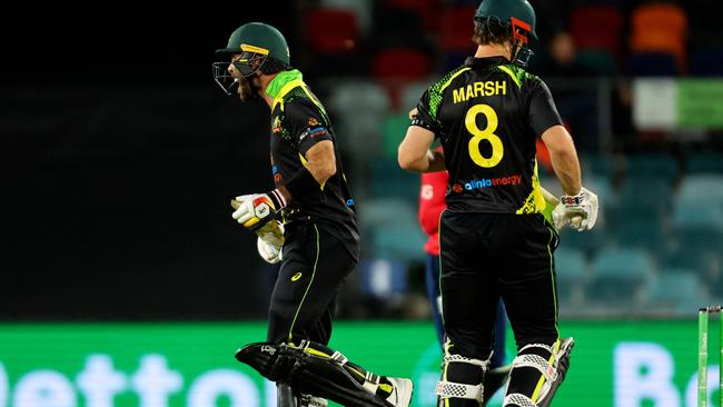 Australia's Glenn Maxwell (L) reacts after his dismissal during the second T20 match against England at Manuka Oval.