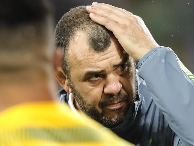 Australia coach Michael Cheika watches as his players warm up ahead of the Rugby World Cup Pool D game at Shizuoka Stadium Ecopa between Australia and Georgia in Shizuoka, Japan, Friday, Oct.11, 2019. (AP Photo/Christophe Ena)