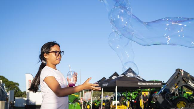 Chlouie Lavers plays with bubbles at Toowoomba Royal Show, Thursday, March 30, 2023. Picture: Kevin Farmer