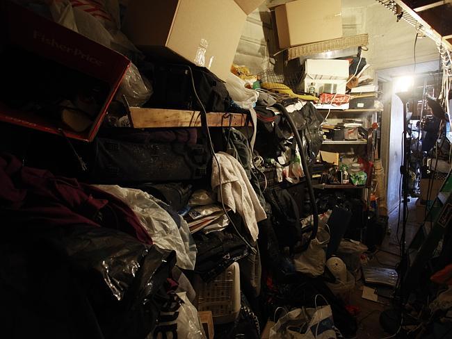 He lives surrounded by junk, shoved in cupboards and strewed around the apartment.
