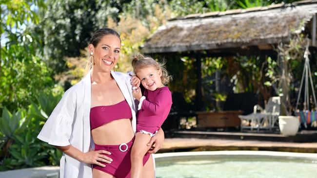 SELF LOVE: Coast swimwear creator, Monika King, was fed up with hearing women speak negatively towards themselves as they tried on bikinis so she decided to create her own label to change the way women mentally approach swimwear shopping. Pictured with her daughter, Zara Cashin, 2. Picture: Patrick Woods.