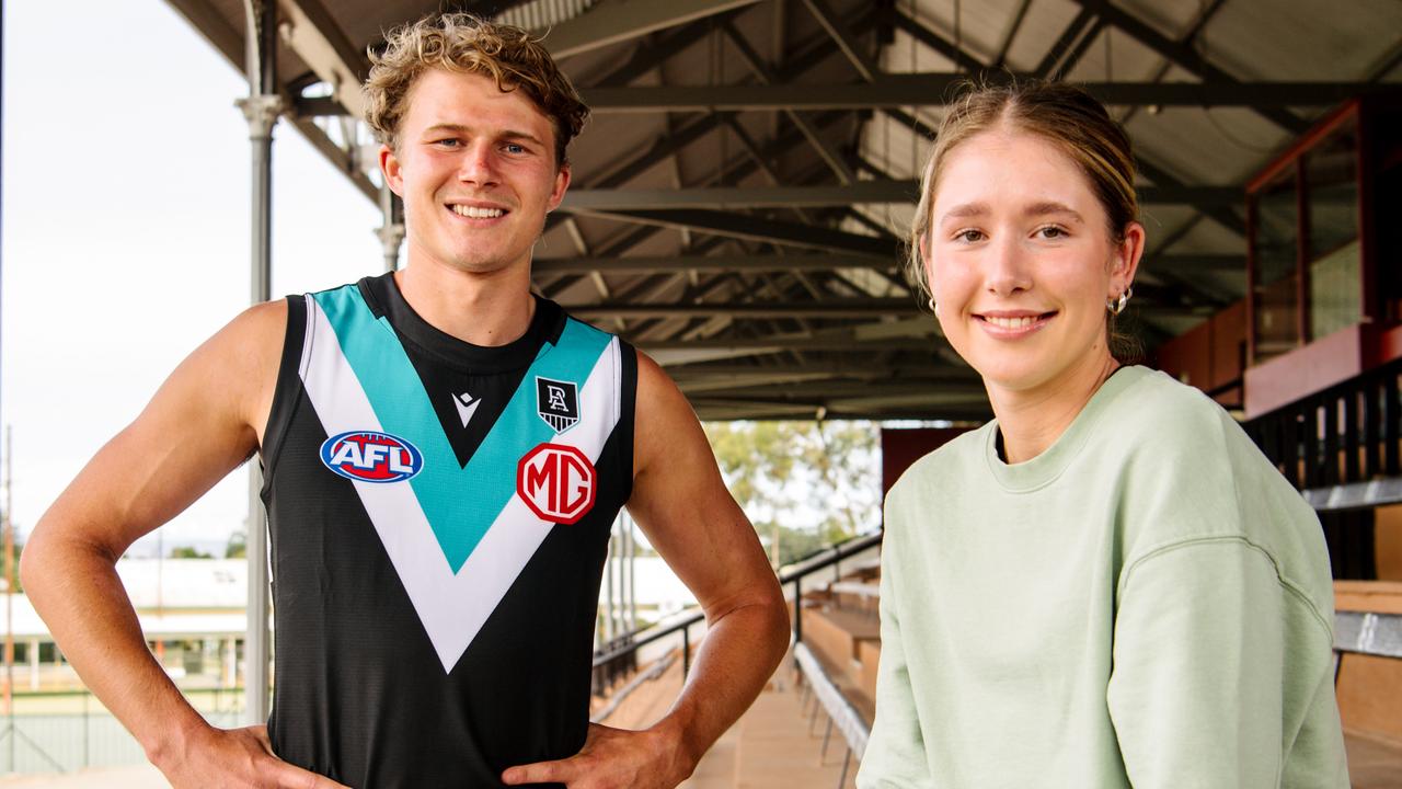 Port Adelaide’s Xavier Duursma with guernsey designer Lucy Burford at Alberton Oval. Picture: Morgan Sette