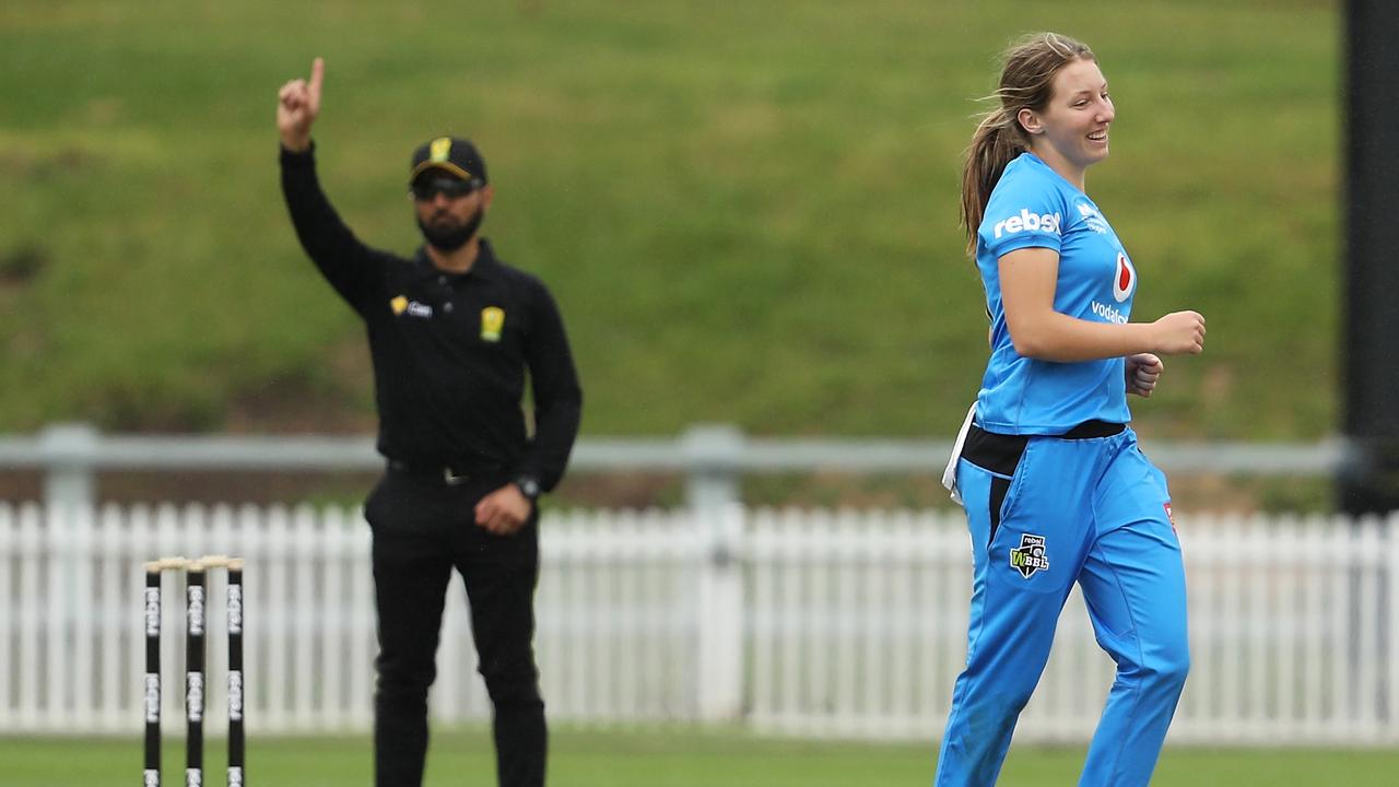 Darcie Brown smiles after claiming the wicket of Sophie Devine.