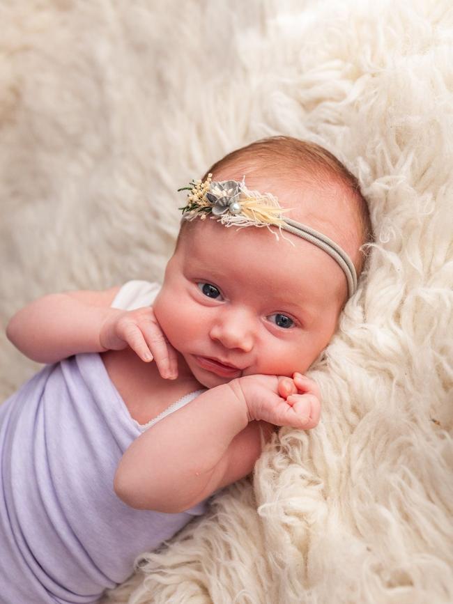 Mia Marie Marnell, six weeks old. My precious Mia is a bright happy baby girl who loves story time. She is our rainbow baby who laughs, smiles and brings us joy and happiness. We are blessed as first time parents.