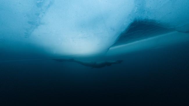 Ant Williams swims under the ice in Iceland during his world record breaking dive - an experience that Apple as documented in a series created for Vision Pro.