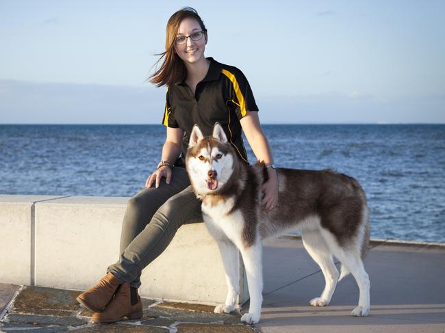 Maddie Ross of Burleigh Waters with her husky, Clay. Maddie is the head trainer and owner of Beacon Dog Training. Picture: Sam Wright/Tails Photography