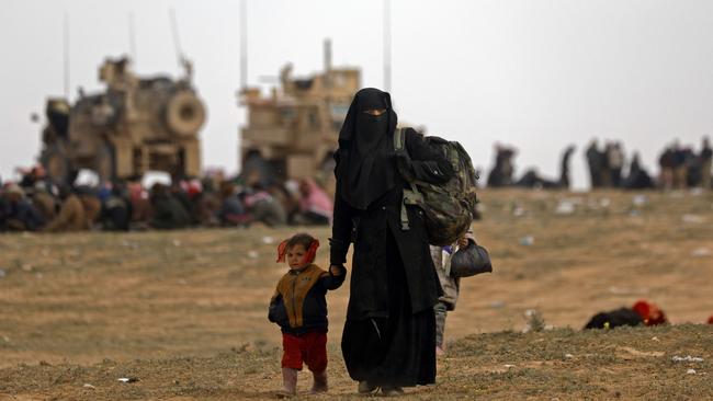 Civilians fleeing the embattled holdout of Baghouz. Picture: AFP