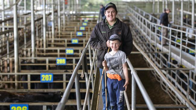 Landmark agent Cody Loughridge, Leongatha, and Byron Wallis, 7, Leongatha, at the Leongatha store sale. Picture: Dannika Bonser.