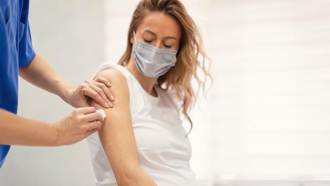 A pregnant woman receives a Covid-19 vaccine. Picture: Getty Images.