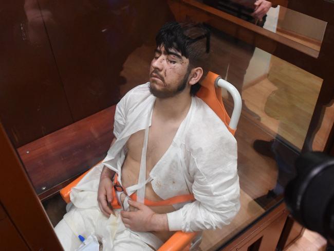 The youngest suspect was in a wheelchair with a catheter and urine bag on his lap. AFP)