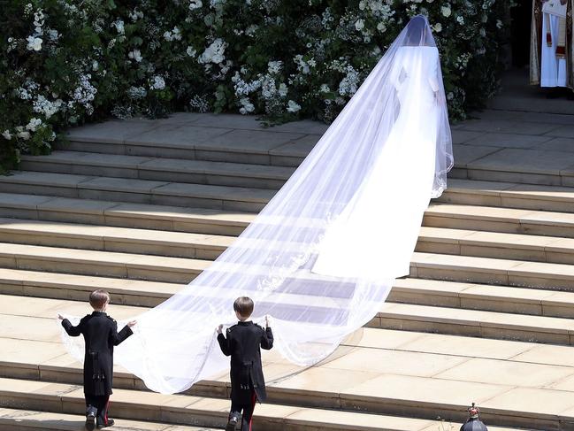 She was then helped up the chapel steps by the Mulroney twins. Picture: Andrew Matthews