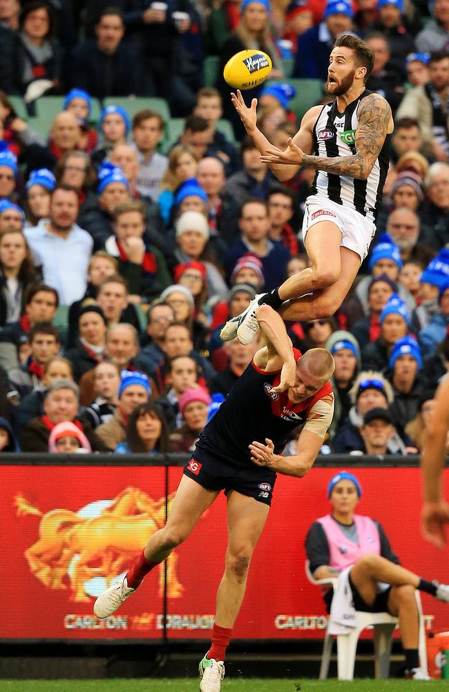 2017: Collingwood’s Jeremy Howe has become known for his high-flying marks. But this speccy over Melbourne’s Tom McDonald wasn’t even enough to win him Mark of the Year. Picture: Mark Stewart