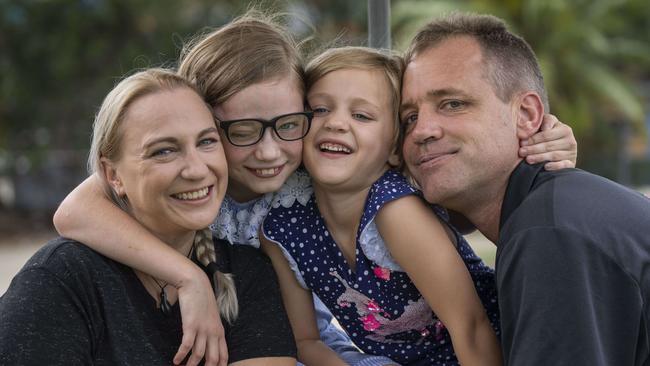 Jenni and Cameron Elliott with their daughters Elizabeth (Libby), 9, and Kaitlyn, 6. Libby was diagnosed with neurofibromatosis 2 at the age of four. Picture: AAP/Matthew Vasilescu