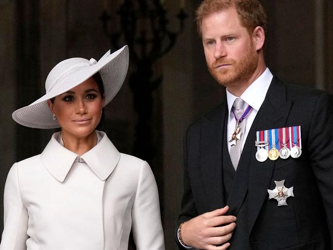 Britain's Prince Harry, Duke of Sussex, and Meghan, Duchess of Sussex, leave at the end of the National Service of thanksgiving for The Queen's reign at Saint Paul's Cathedral in London. Picture: Matt Dunham / AFP.