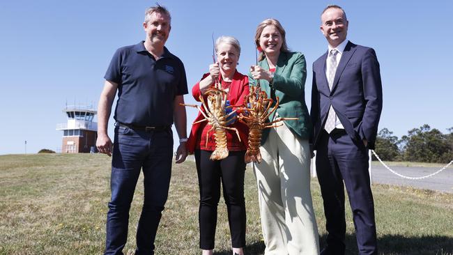 Julian Harrington CEO Seafood Industry Tasmania, Senator Catryna Bilyk, Minister Julie Collins, Norris Carter CEO Hobart Airport. Hobart Airport runway works progress. Picture: Nikki Davis-Jones