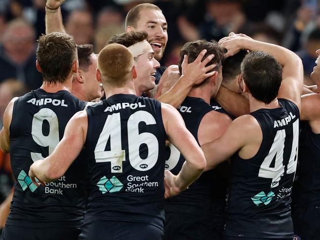 MELBOURNE, AUSTRALIA - APRIL 20: Blues players celebrate during the 2024 AFL Round 06 match between the Carlton Blues and the GWS GIANTS at Marvel Stadium on April 20, 2024 in Melbourne, Australia. (Photo by Michael Willson/AFL Photos via Getty Images)