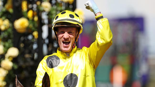 Mark Zahra celebrates winning the Melbourne Cup on Without A Fight.