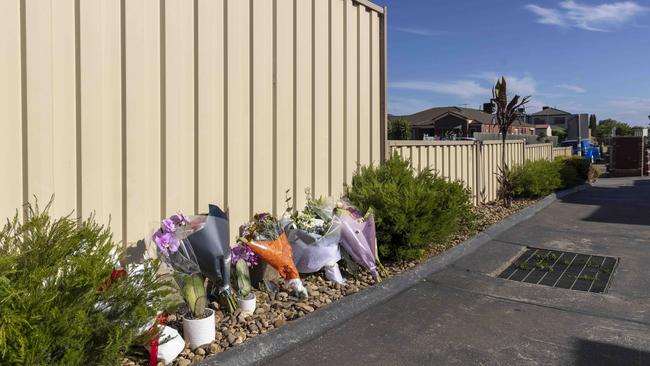 Flowers are placed at the scene of the fatal knife attack. Picture: Wayne Taylor