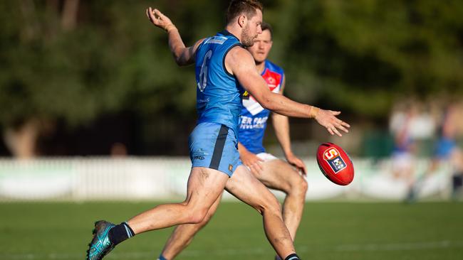 Sturt defender Connor McFadyen sends the Double Blues forward in their thrilling three-point win against Central District. Picture: Ben Clark.