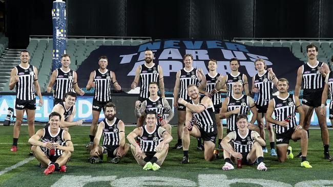 The Port Adelaide players in their prison bars after demolishing the Crows in Showdown 48. Picture: Sarah Reed