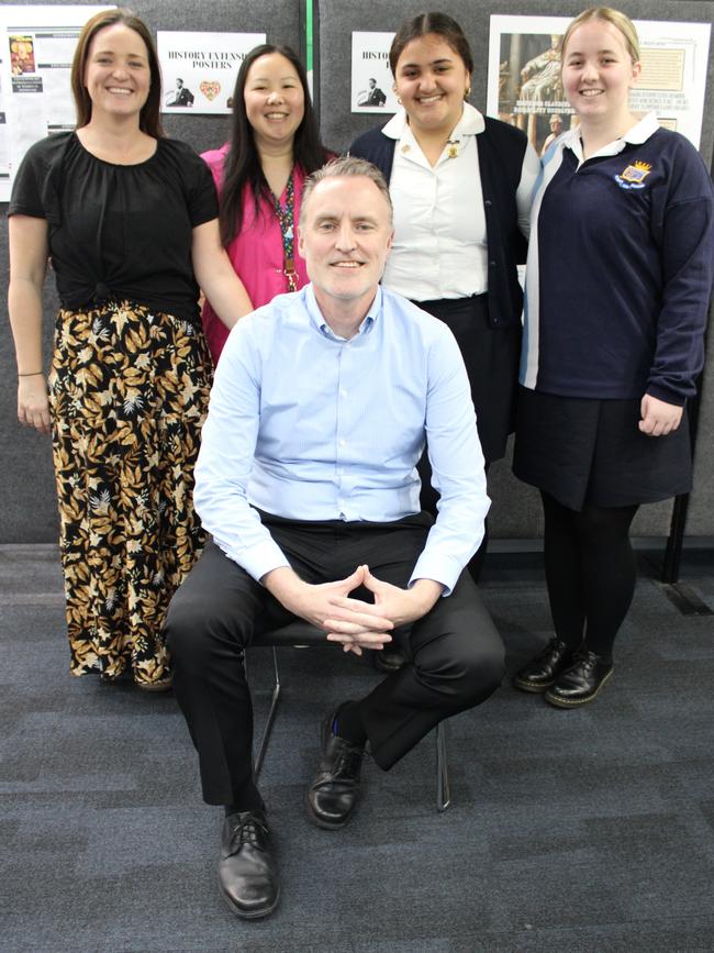 Dr Chris Reynolds (centre) with science teachers Vanessa Brown and Audrey Soo and students Hannah Singh and Isabella Collins. Picture: Supplied