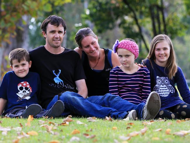 Dustin Perry with wife Shannon and kids Theo, Chloe and Lilly. Chloe has a rare and deadly brain cancer. Picture: Aaron Francis