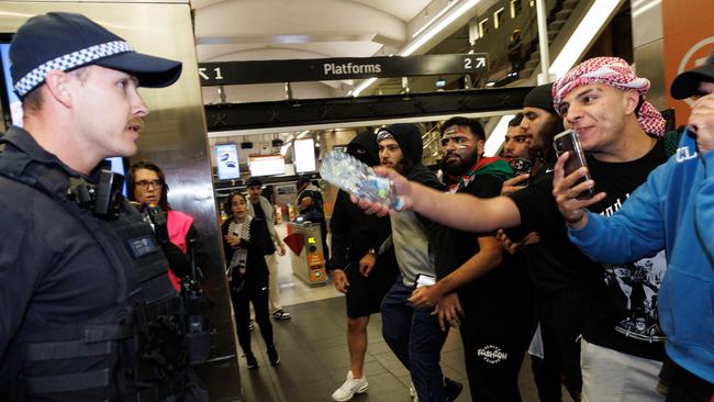 Pro-Palestine supporters confront police at Sydney’s Circular Quay Station. Picture: David Swift